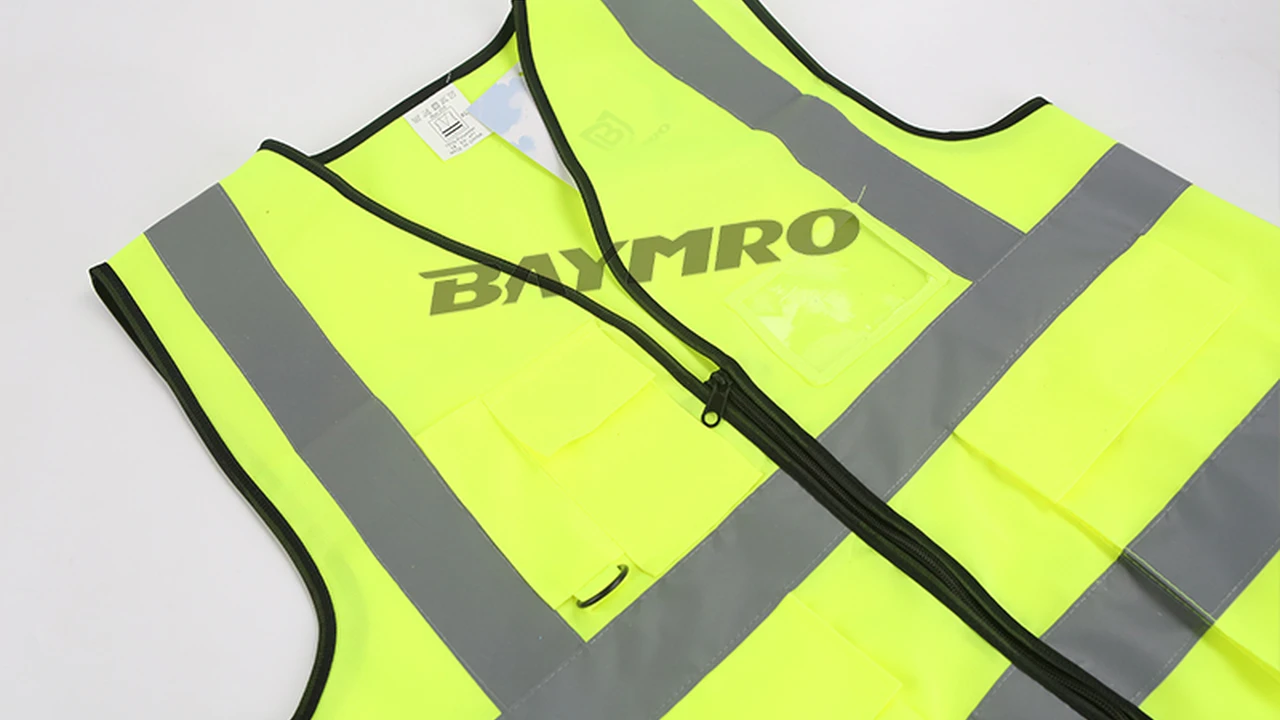 blue bowl of black bean beef tortilla soup on a board with cilantro and shredded cheese in background