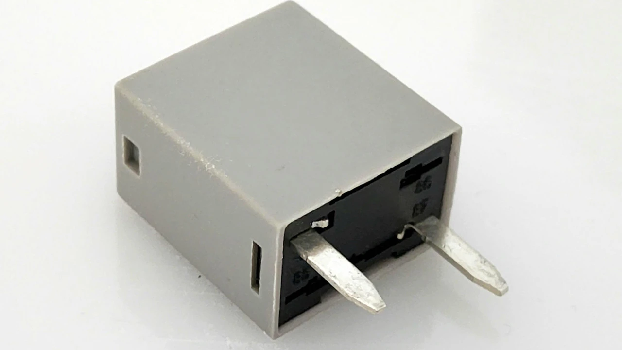 Two mint chocolate milkshakes with whipped cream and green sprinkles.