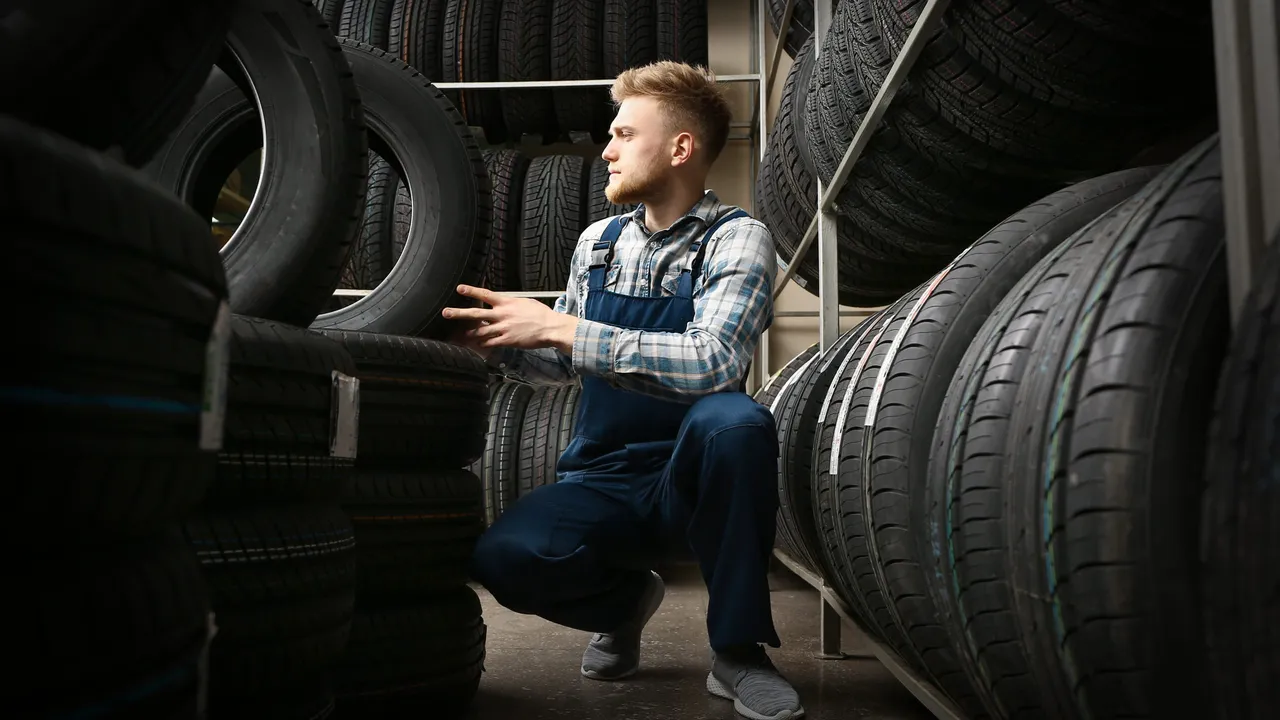 blue bowl of black bean beef tortilla soup on a board with cilantro and shredded cheese in background
