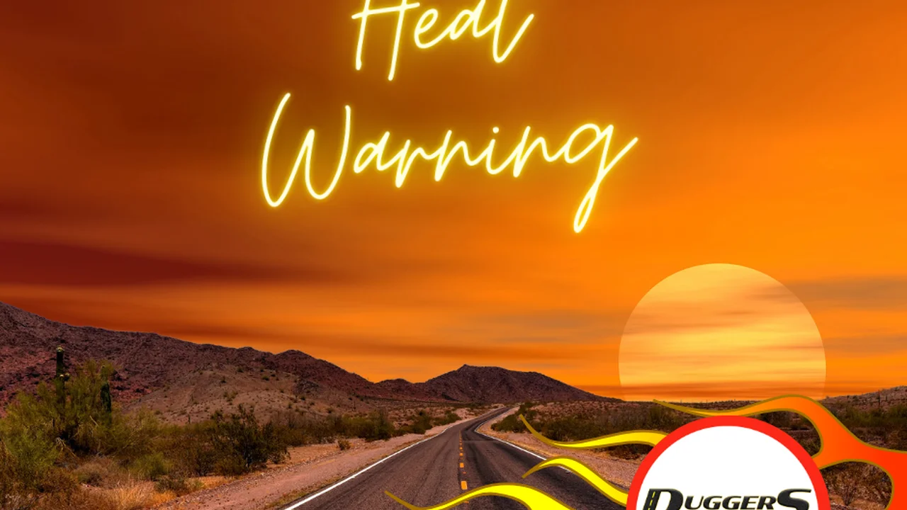 blue bowl of black bean beef tortilla soup on a board with cilantro and shredded cheese in background