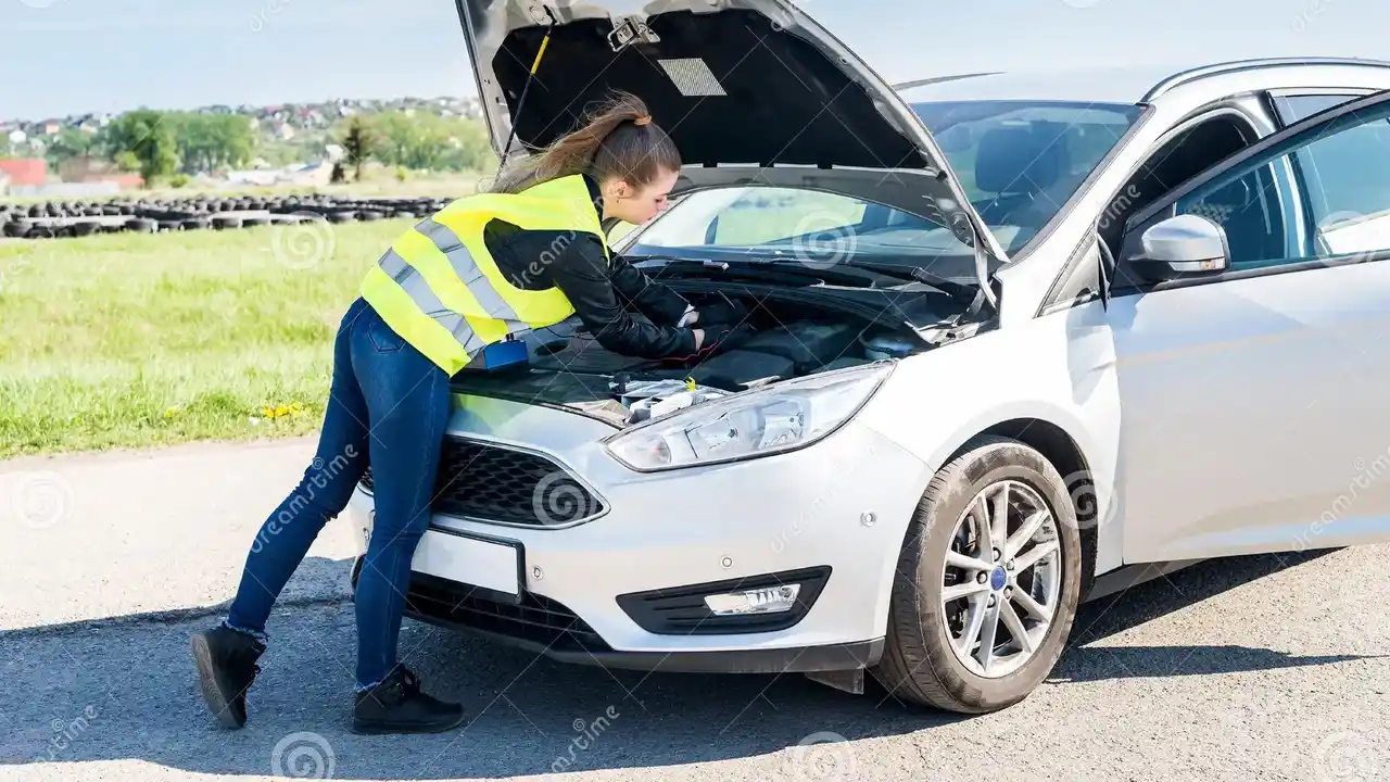 blue bowl of black bean beef tortilla soup on a board with cilantro and shredded cheese in background
