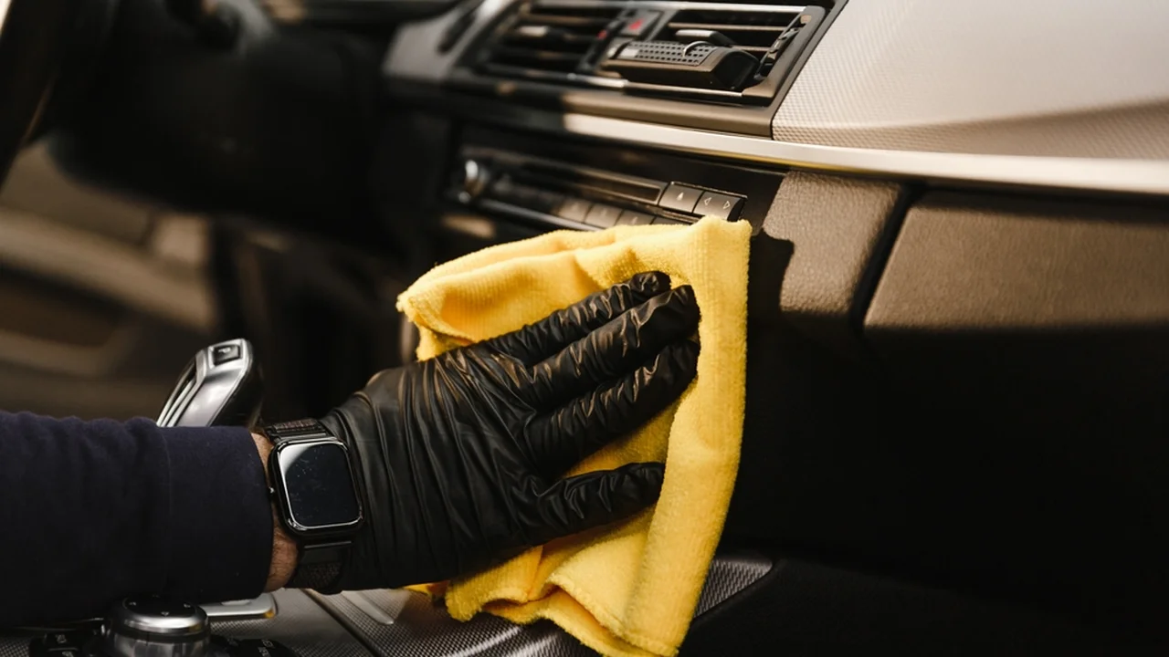 blue bowl of black bean beef tortilla soup on a board with cilantro and shredded cheese in background