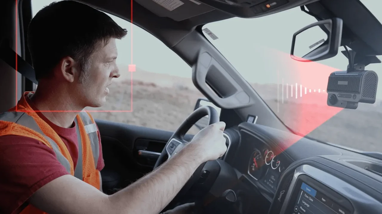 blue bowl of black bean beef tortilla soup on a board with cilantro and shredded cheese in background